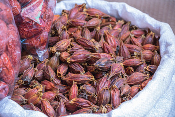 Dried gardenia fruit on sale in market.