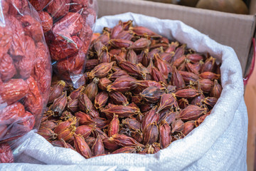 Dried gardenia fruit on sale in market.