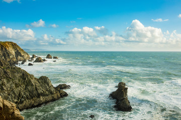 Waves crashing over the rocks on the California coast near San Francisco.