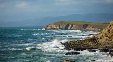 Panorama of waves crashing on the California coast near San Francisco.