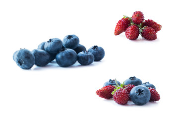 Berries isolated on white background. Ripe blueberries and wild strawberries. Background of mix berries with copy space for text. Mix berries on white background.