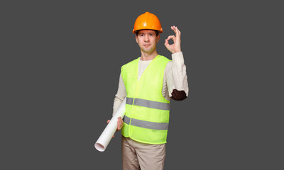 the civil engineer in a helmet shows gesture - OK, everything is good