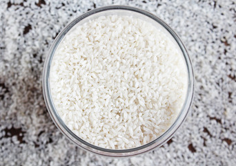 white rice scattered on a wooden table