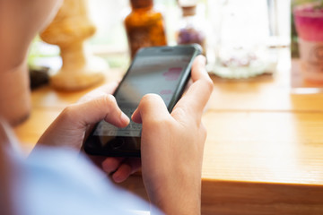 close up on woman hands using smartphone