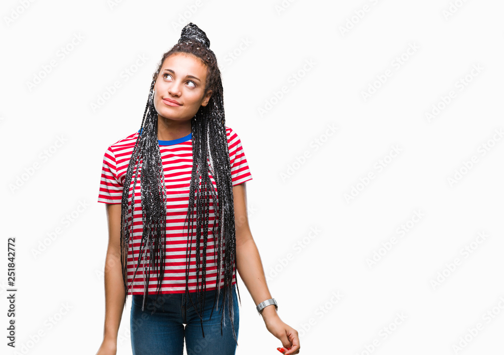 Sticker Young braided hair african american girl over isolated background smiling looking side and staring away thinking.