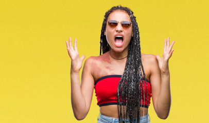 Young braided hair african american with birth mark wearing sunglasses over isolated background...