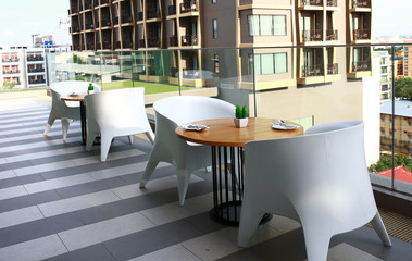 open air of dining table on high building of hotel or condominium , Terrace cafe,open air