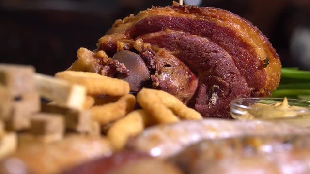 Delicious food. German cuisine grilled pork and sausages on a disg