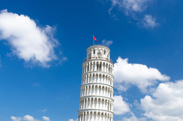 Fototapeta na wymiar Leaning Tower Torre di Pisa on Piazza del Miracoli square, blue sky with white clouds background in beautiful sunny day, view from below close-up copy space isolated, Tuscany, Italy