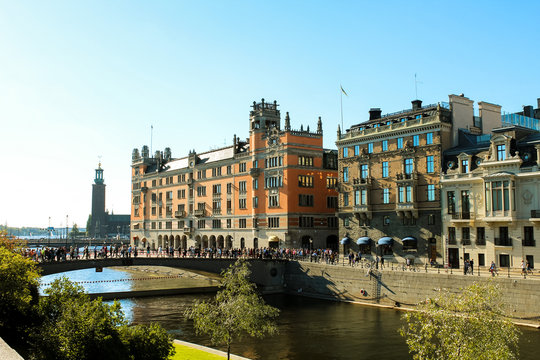 Rosenbad - the Swedish government bulding - during a clear summer day with green trees as seen from the island Riksplan (Stockholm, Sweden, Europe)