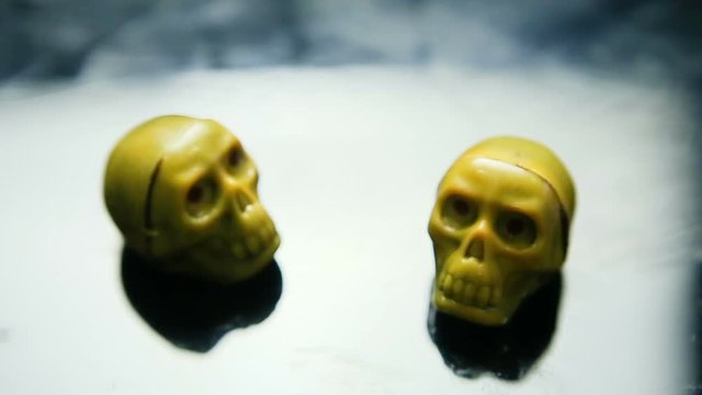 focus out from two chocolate candies in skeleton skull shape