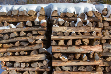 Neatly stacked firewood. Close-up