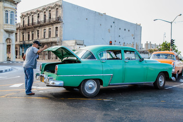 Havana, Cuba - 12 January 2013: The streets of Havana with very old American cars