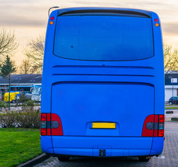The back of a blue touring bus with a lot of blank space to put whatever you want, travel industry background