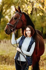 Foto op Canvas Woman with her horse at sunset, autumn outdoors scene © matilda553