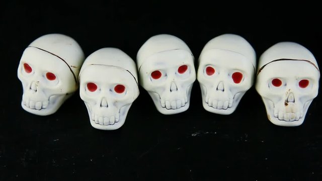 panorama on white chocolate candies in skeleton skull shape