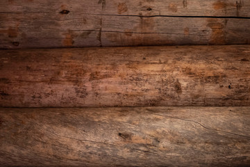 Background and texture of natural wood logs. The old wall is brown. Copy space.