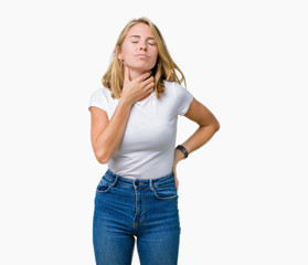 Fototapeta premium Beautiful young woman wearing casual white t-shirt over isolated background Touching painful neck, sore throat for flu, clod and infection