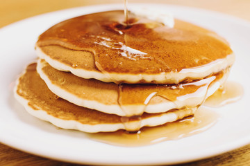 Fototapeta na wymiar Pancakes with Syrup