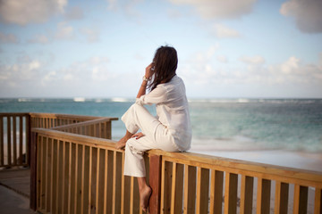 Dreamy girl pose on tropical beach