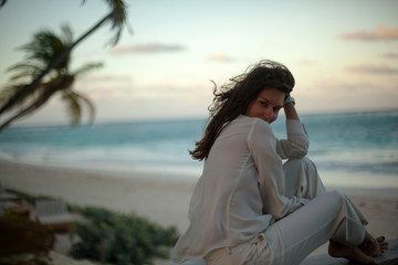 Dreamy girl pose on tropical beach