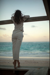 Dreamy girl pose on tropical beach