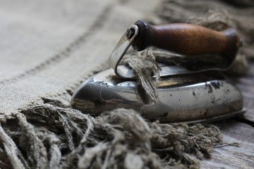 A little old iron isolated on gray background.