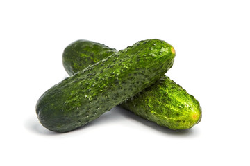 Two gherkins isolated on white background