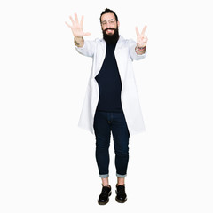 Doctor therapist man with long hair and bear wearing white coat showing and pointing up with fingers number seven while smiling confident and happy.