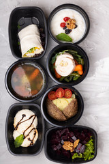 food steamed in lunch boxes, meat rolls and cutlets with soup, top view