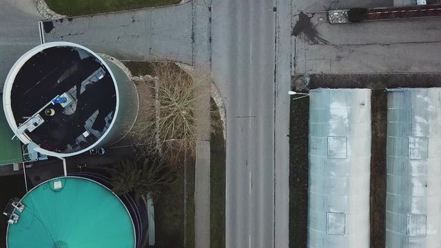Flying over industrial buildings. Top view.