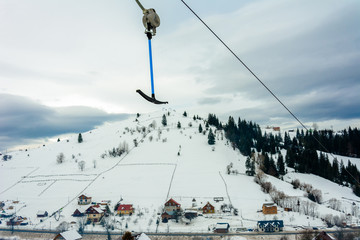 Fototapeta premium Ski-lift while driving on the highway in the Carpathian resort