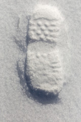 traces of shoes on a background of snow