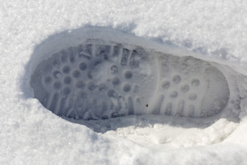 traces of shoes on a background of snow