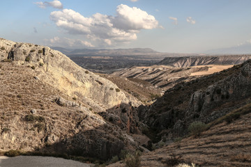 stunning amazing view from the top of a ruff rocky mountain in front of a cloudy sky nice weather