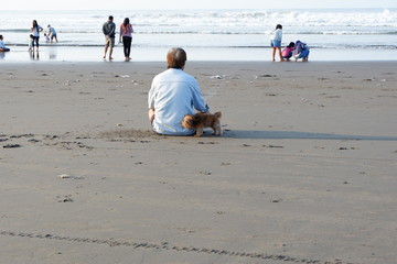 someone who is praying on the beach