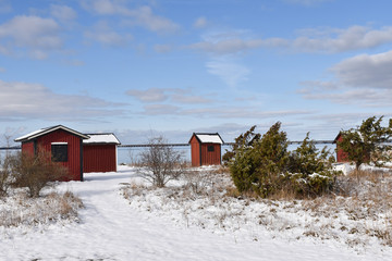 Winter view by old fishing cabins