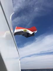 Egypt big realistic national flag waving in blue sk