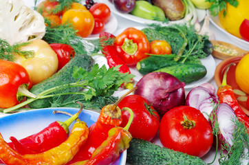 Vegetables on the table. Carrots, beets, tomatoes, cabbage, peppers, cucumbers, peas, garlic, parsley