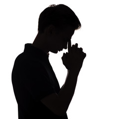 black and white silhouette portrait of an pensive man with leaning his hand on forehead in stress, guy face profile on a white isolated background,concept teenager problem and emotional stress