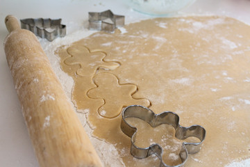 Holiday Cutout Sugar Cookies With Silver Gingerbread Boy Cutter and Wooden Rolling Pin