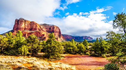 Fototapeta na wymiar Clouds and blue sky over Courthouse Butte between the Village of Oak Creek and the town of Sedona in northern Arizona in Coconino National Forest, United States of America