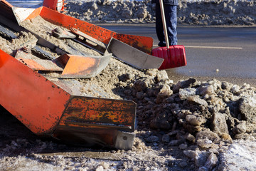 snow combine harvests dirty snow on the road. Gatchina, Russia. snow removal, reportage shooting.