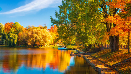 Colorful fall. Scenic autumn landscape with multi colored trees on lakeside.