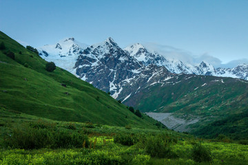Fototapeta na wymiar Mountains landscape. Snowy summits in Caucasus range