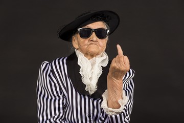 Old grandma in a white-black striped jacket