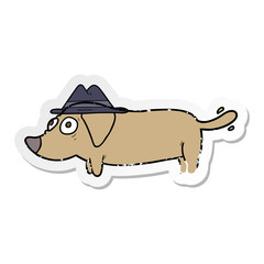 distressed sticker of a cartoon dog wearing hat