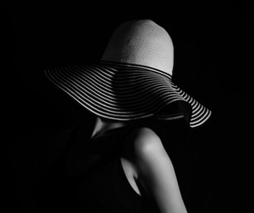 Photo of young beautiful and pretty girl in hat in vintage and retro black-and-white style which can be good picture in fashion, cosmetic, cosmetology advertising. 