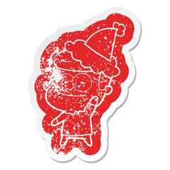 cartoon distressed sticker of a happy man wearing santa hat
