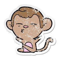 distressed sticker of a cartoon suspicious monkey